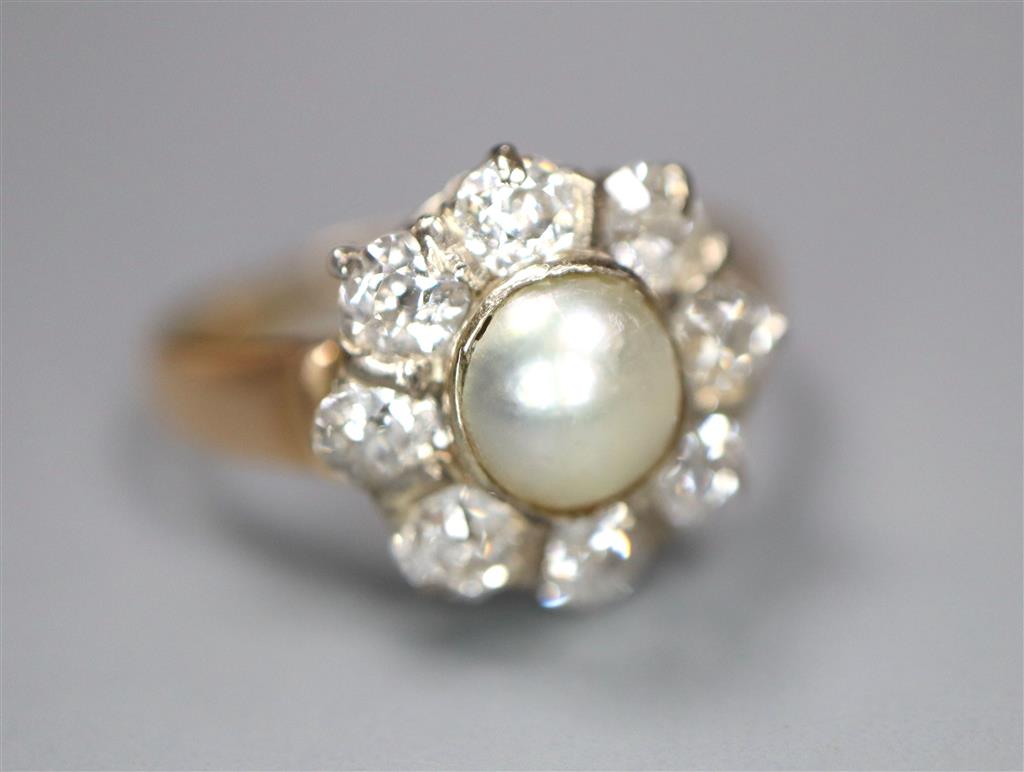 A yellow metal, cultured pearl and diamond set flower head cluster ring, size L, gross 3.1 grams,